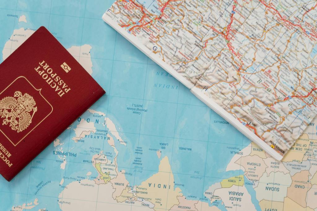 maps from world atlases and a passport